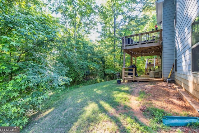 view of yard with a wooden deck