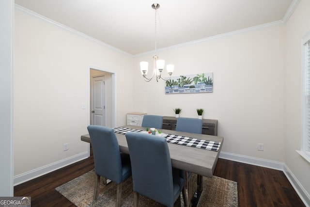 dining area featuring ornamental molding, a notable chandelier, and dark hardwood / wood-style flooring