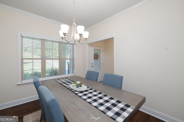 dining area featuring a notable chandelier, crown molding, and dark wood-type flooring