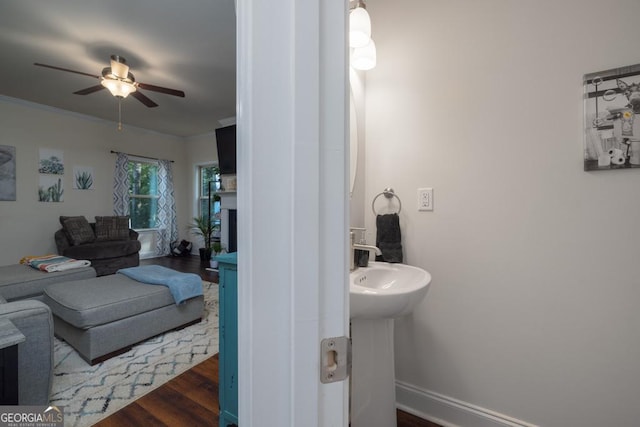 bathroom featuring hardwood / wood-style flooring and ceiling fan