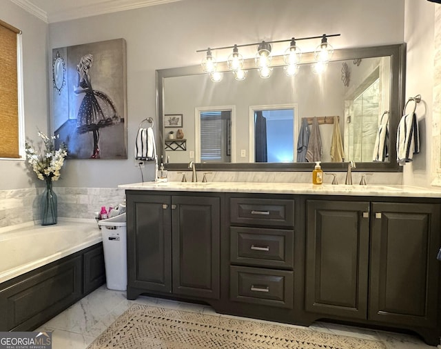 bathroom with a bathing tub, ornamental molding, and vanity