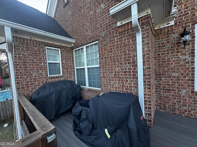 wooden deck featuring area for grilling