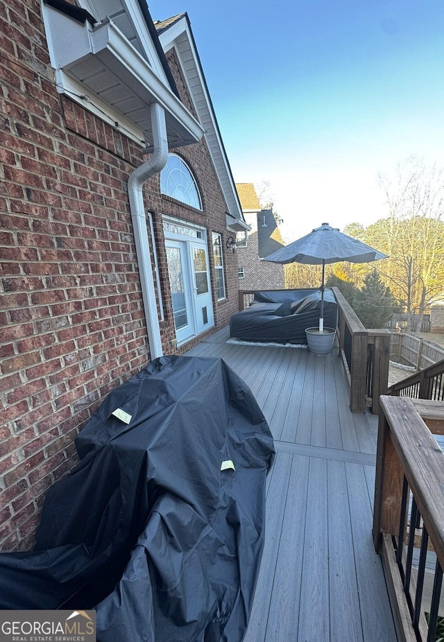 wooden deck with area for grilling