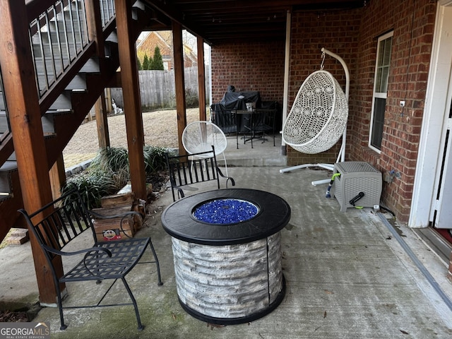 view of patio / terrace featuring a grill and a fire pit