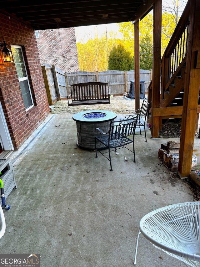 view of patio with a fire pit