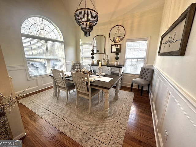 dining room featuring dark wood-type flooring and a notable chandelier