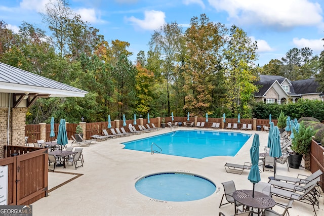 view of pool featuring a patio area