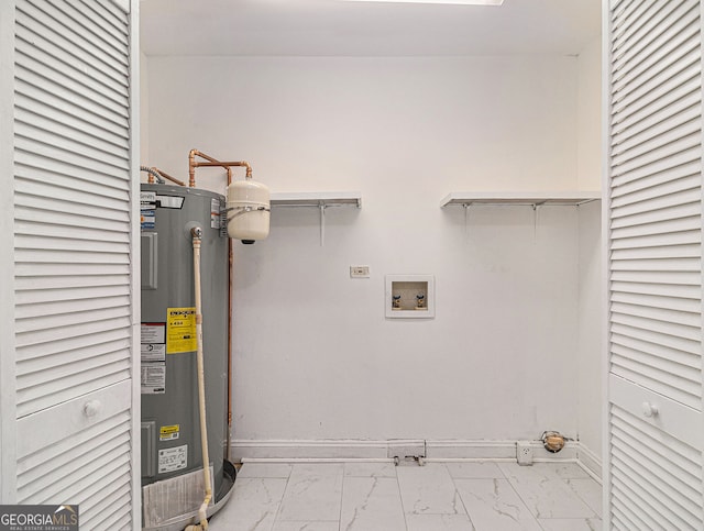 washroom with marble finish floor, hookup for a washing machine, water heater, hookup for an electric dryer, and baseboards