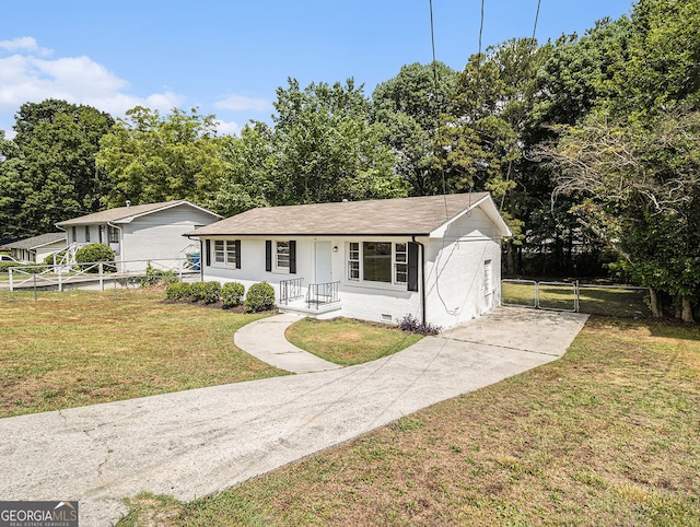 view of front of home featuring a front yard, crawl space, fence, and a gate