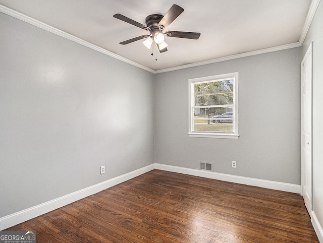 unfurnished room with ceiling fan, visible vents, baseboards, dark wood-style floors, and crown molding