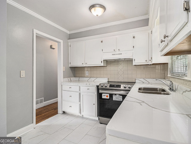 kitchen with under cabinet range hood, stainless steel electric range oven, white cabinets, and a sink