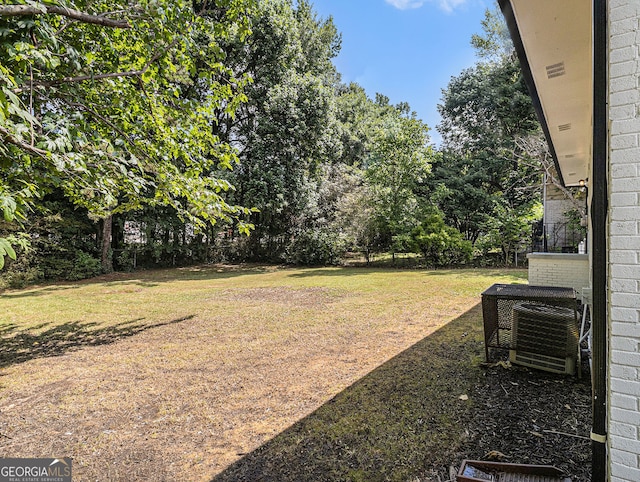 view of yard featuring central air condition unit