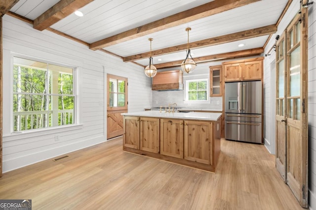 4226 Quail Creek Dr, Flowery Branch, GA 30542 - kitchen featuring stainless steel fridge, light wood-type flooring, light countertops, hanging light fixtures, and premium range hood