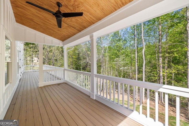 4226 Quail Creek Dr, Flowery Branch, GA 30542 - wooden deck featuring a ceiling fan and view of scattered trees