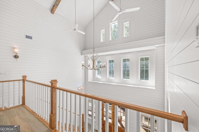 4226 Quail Creek Dr, Flowery Branch, GA 30542 - corridor with high vaulted ceiling, wood finished floors, and a chandelier