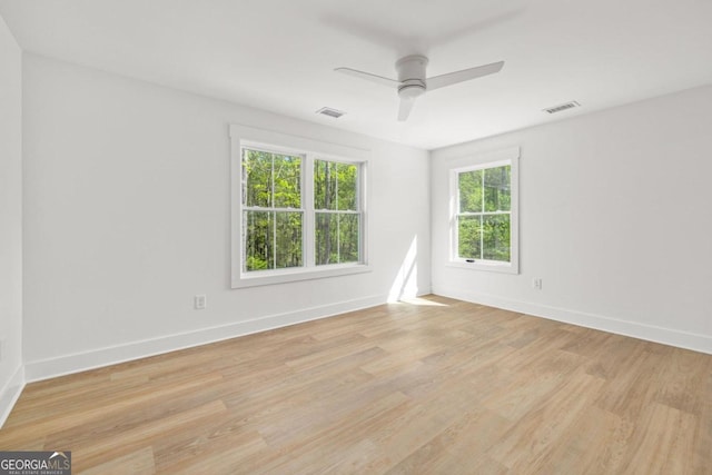 empty room featuring light hardwood / wood-style flooring and ceiling fan