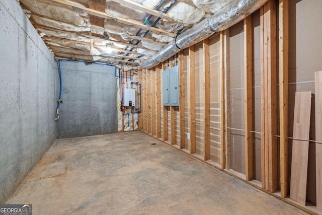 basement featuring water heater and electric panel