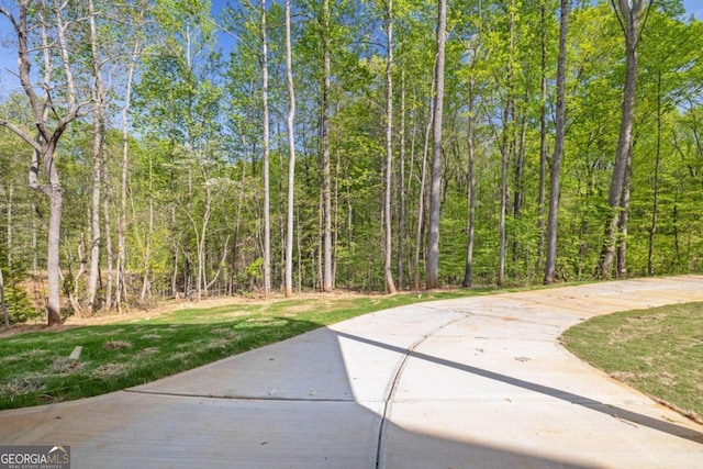 4226 Quail Creek Dr, Flowery Branch, GA 30542 - view of patio / terrace with a wooded view