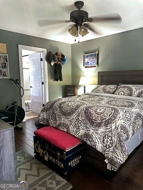 bedroom with hardwood / wood-style floors and ceiling fan