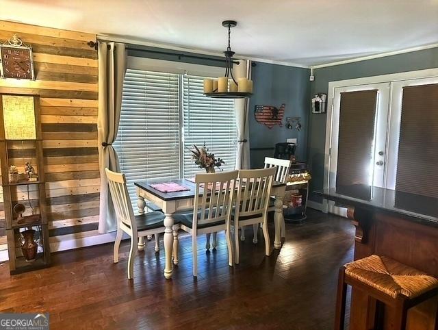 dining space featuring dark hardwood / wood-style floors and french doors