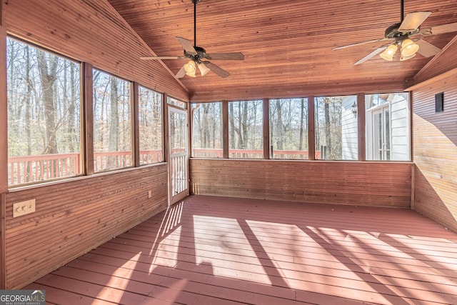 unfurnished sunroom featuring lofted ceiling, a healthy amount of sunlight, wood ceiling, and ceiling fan