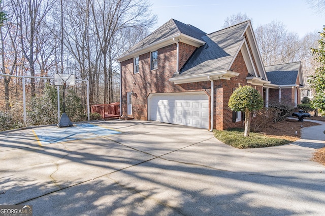 view of side of home with a garage