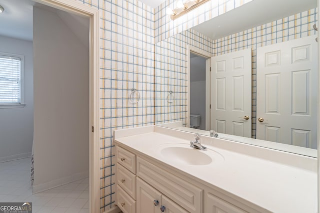 bathroom with tile patterned floors, toilet, and vanity