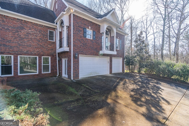 view of side of home with a garage