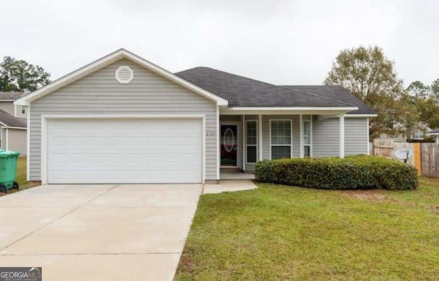 single story home featuring a garage and a front lawn