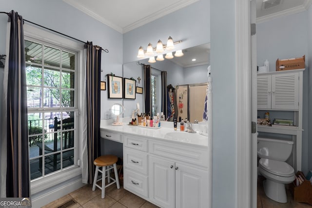 bathroom featuring tile patterned flooring, vanity, crown molding, and toilet