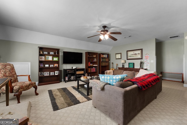 carpeted living room with lofted ceiling and ceiling fan