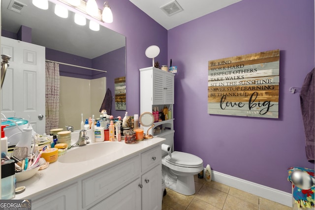 bathroom featuring a shower with curtain, vanity, toilet, and tile patterned flooring