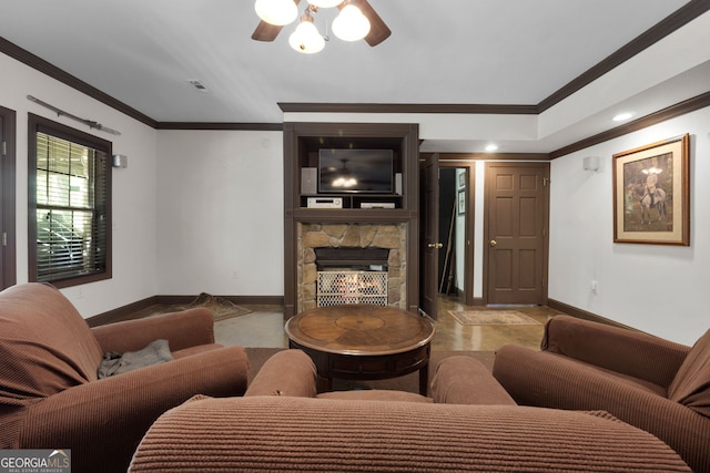 living room with crown molding, a stone fireplace, and ceiling fan