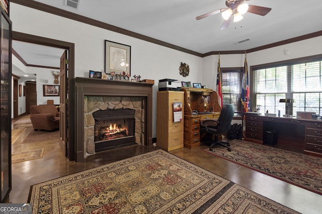 office space featuring a stone fireplace, ornamental molding, and ceiling fan