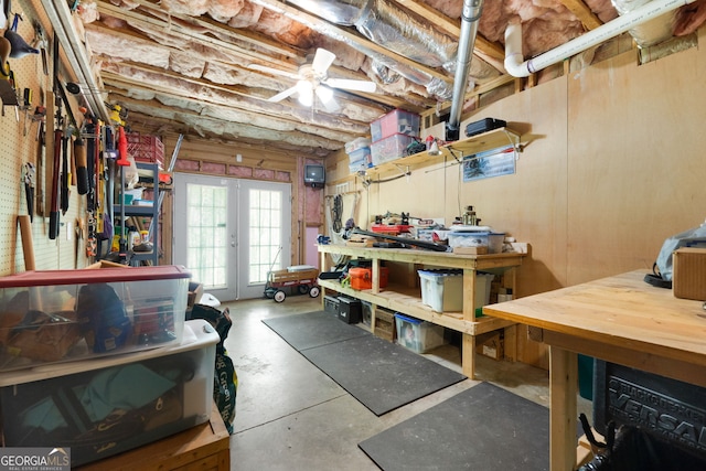 basement with a workshop area, french doors, and ceiling fan