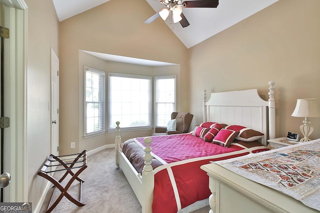 bedroom featuring high vaulted ceiling, light colored carpet, and ceiling fan