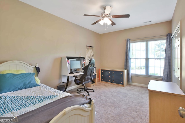 bedroom featuring light carpet and ceiling fan