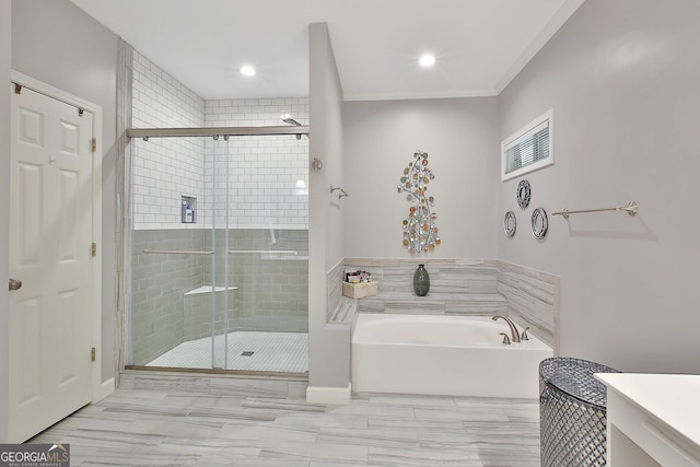 bathroom with shower with separate bathtub and vanity