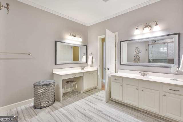 bathroom featuring ornamental molding, hardwood / wood-style floors, and vanity