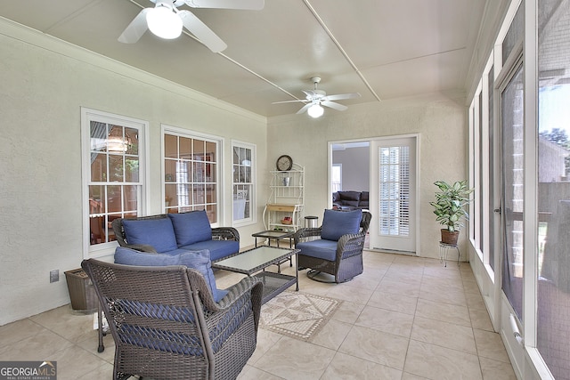 sunroom featuring ceiling fan