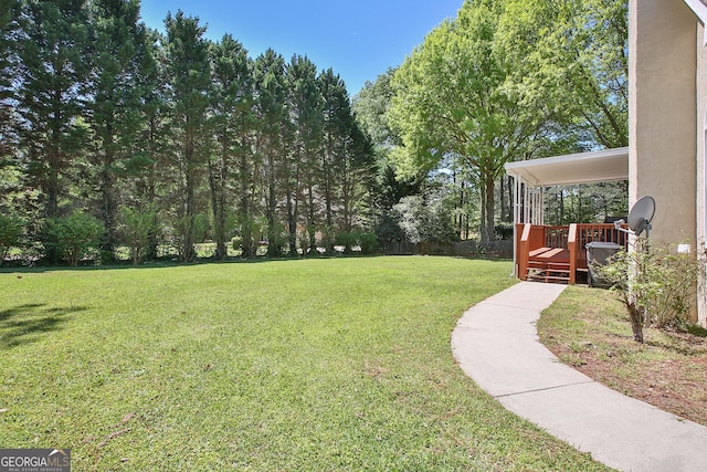 view of yard with a deck