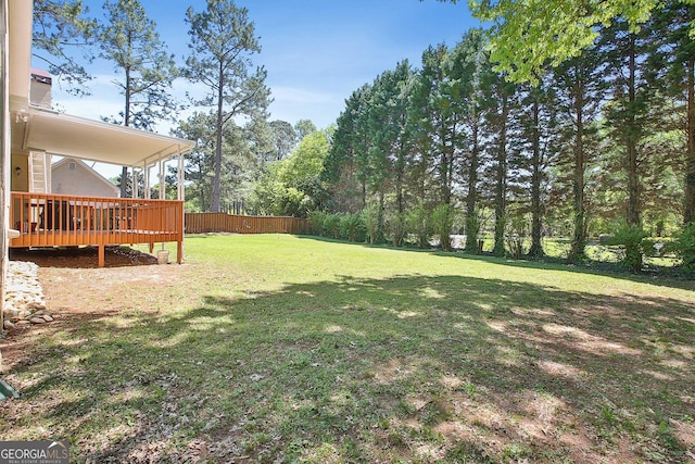 view of yard featuring a wooden deck