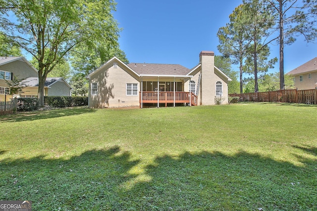 back of house with a yard