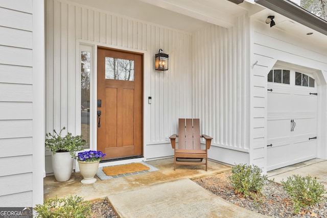 view of exterior entry with a garage