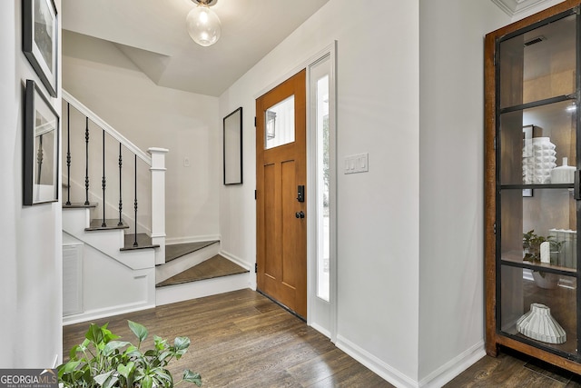 foyer entrance with dark wood-type flooring