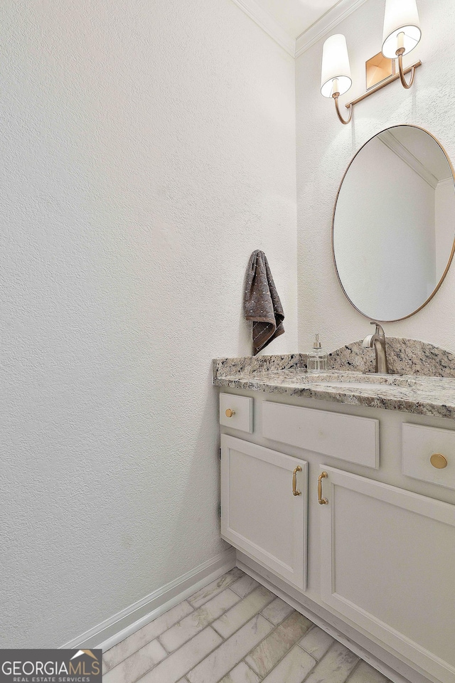 bathroom featuring crown molding and vanity