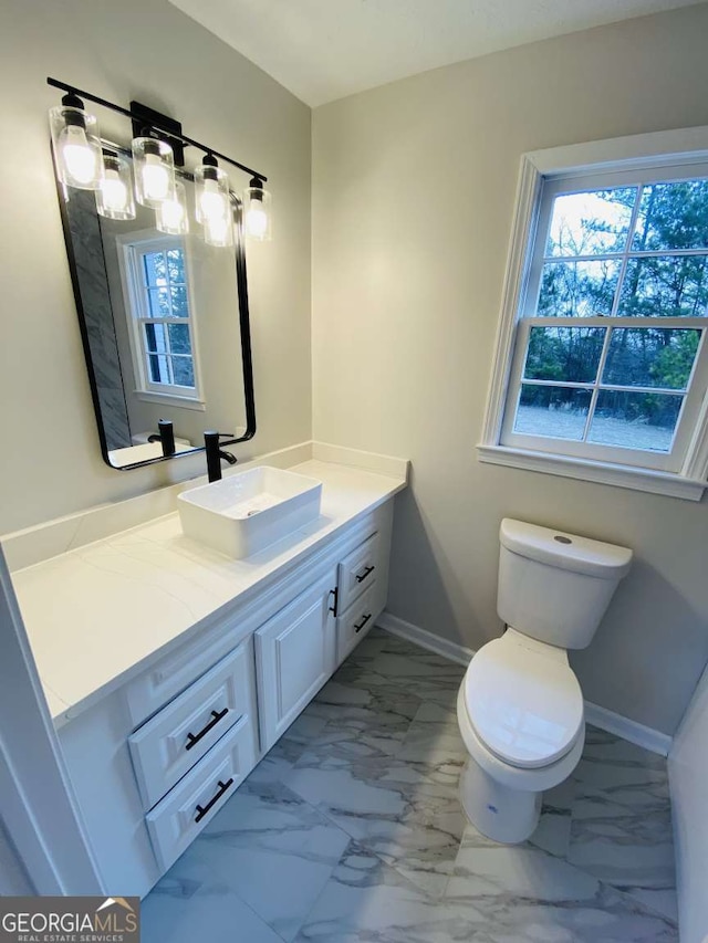 bathroom with vanity and toilet