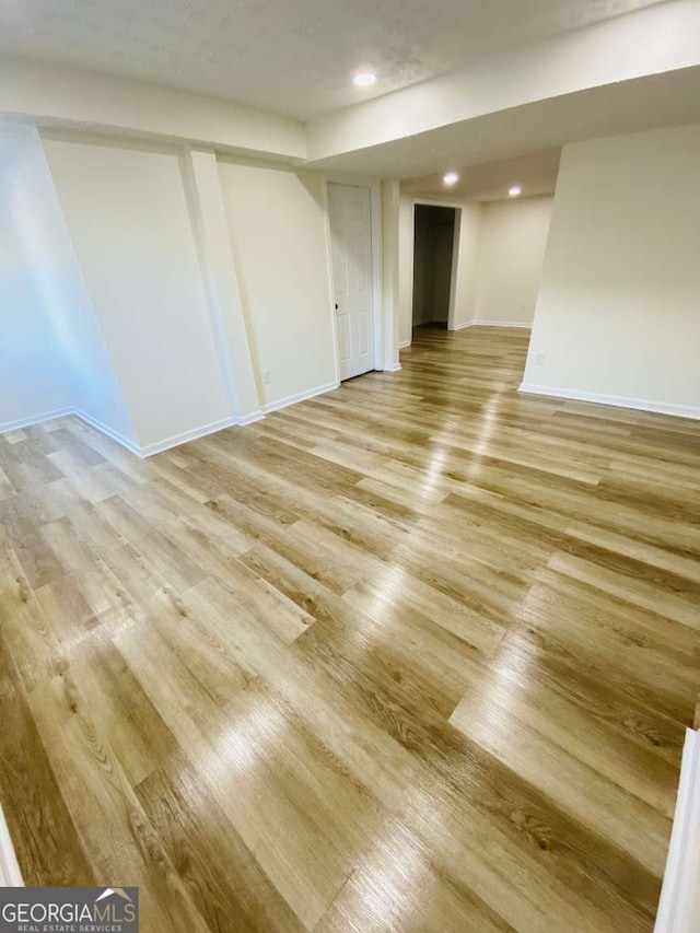 basement featuring light wood-type flooring