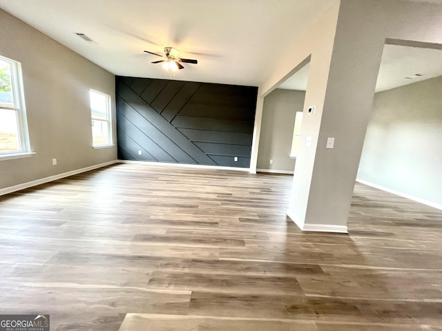 interior space with hardwood / wood-style flooring and ceiling fan