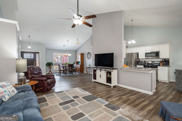 living room featuring ceiling fan, dark hardwood / wood-style floors, and high vaulted ceiling